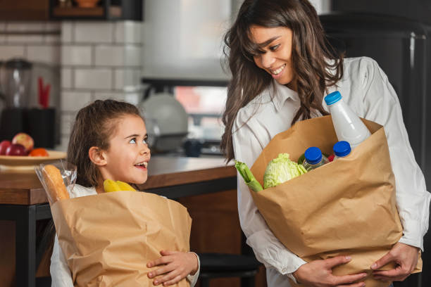 Family holding a grocery bag