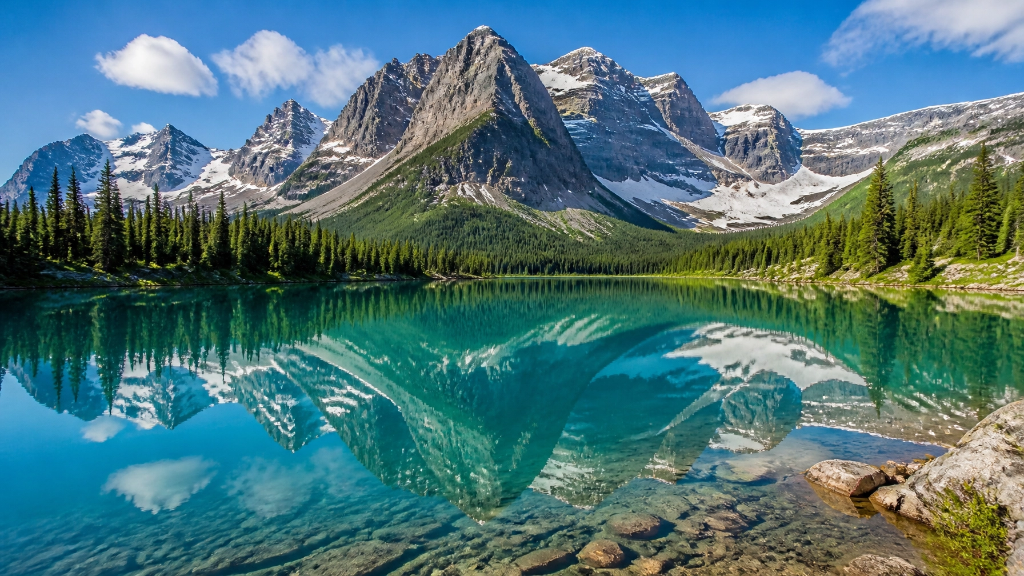 Alpine mountain lake with turquoise water and snow-capped peaks