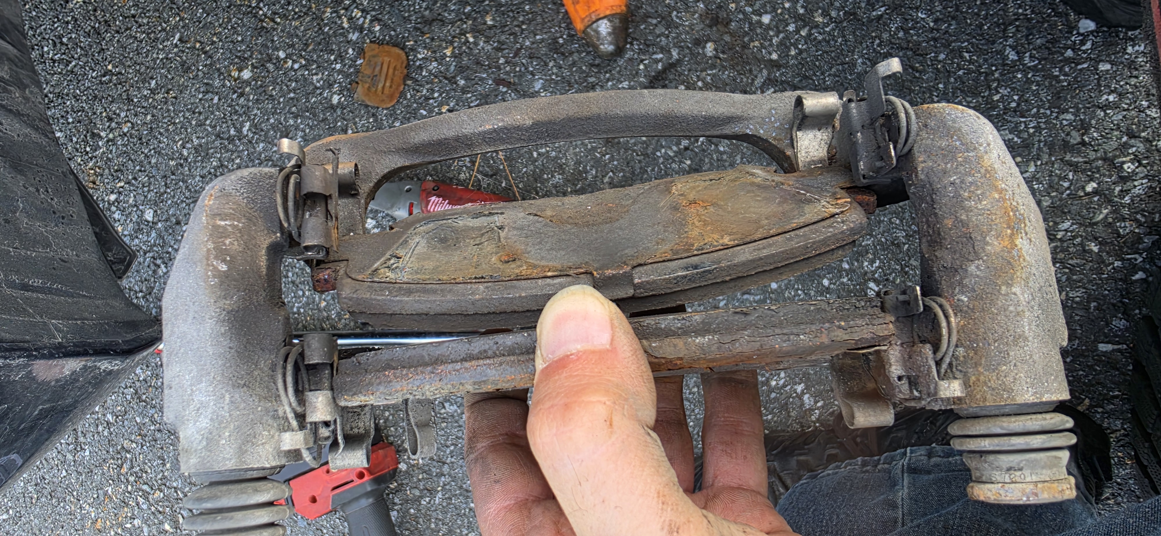 Worn brake pads from a hands-on DIY training session