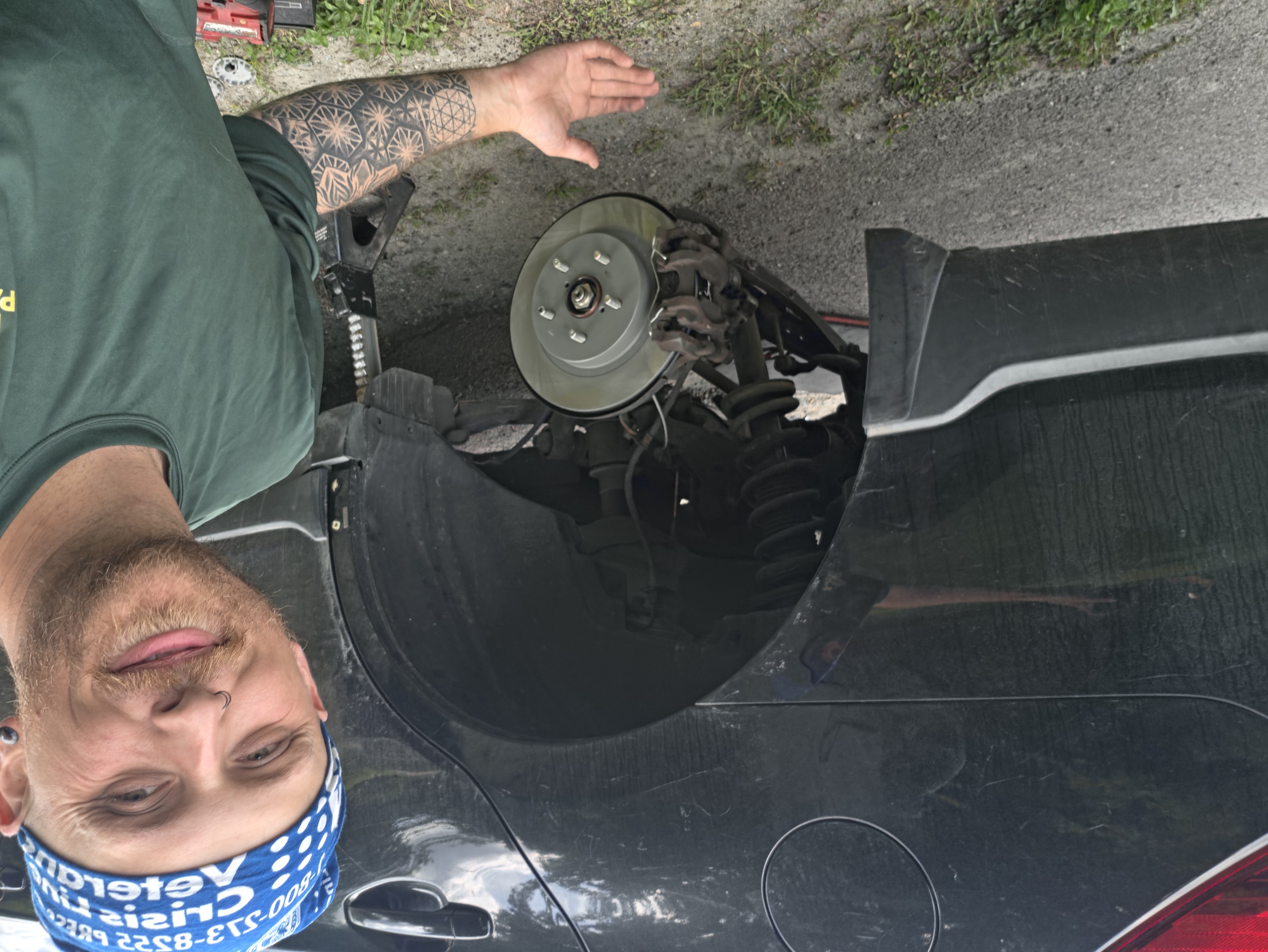 Owner and lead technician finishing a mobile brake job in Vermont