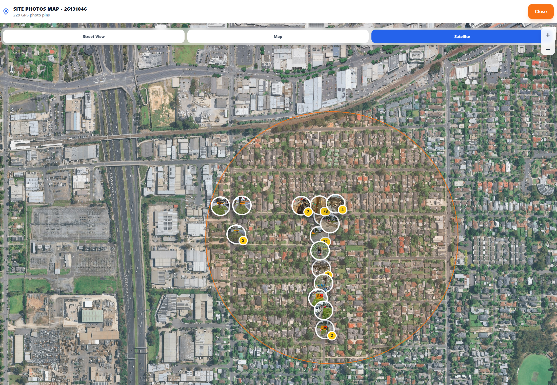 Satellite job media map showing the site boundary and clustered GPS evidence pins