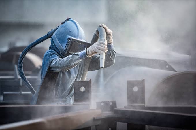 Sand blasting and painting of mining components