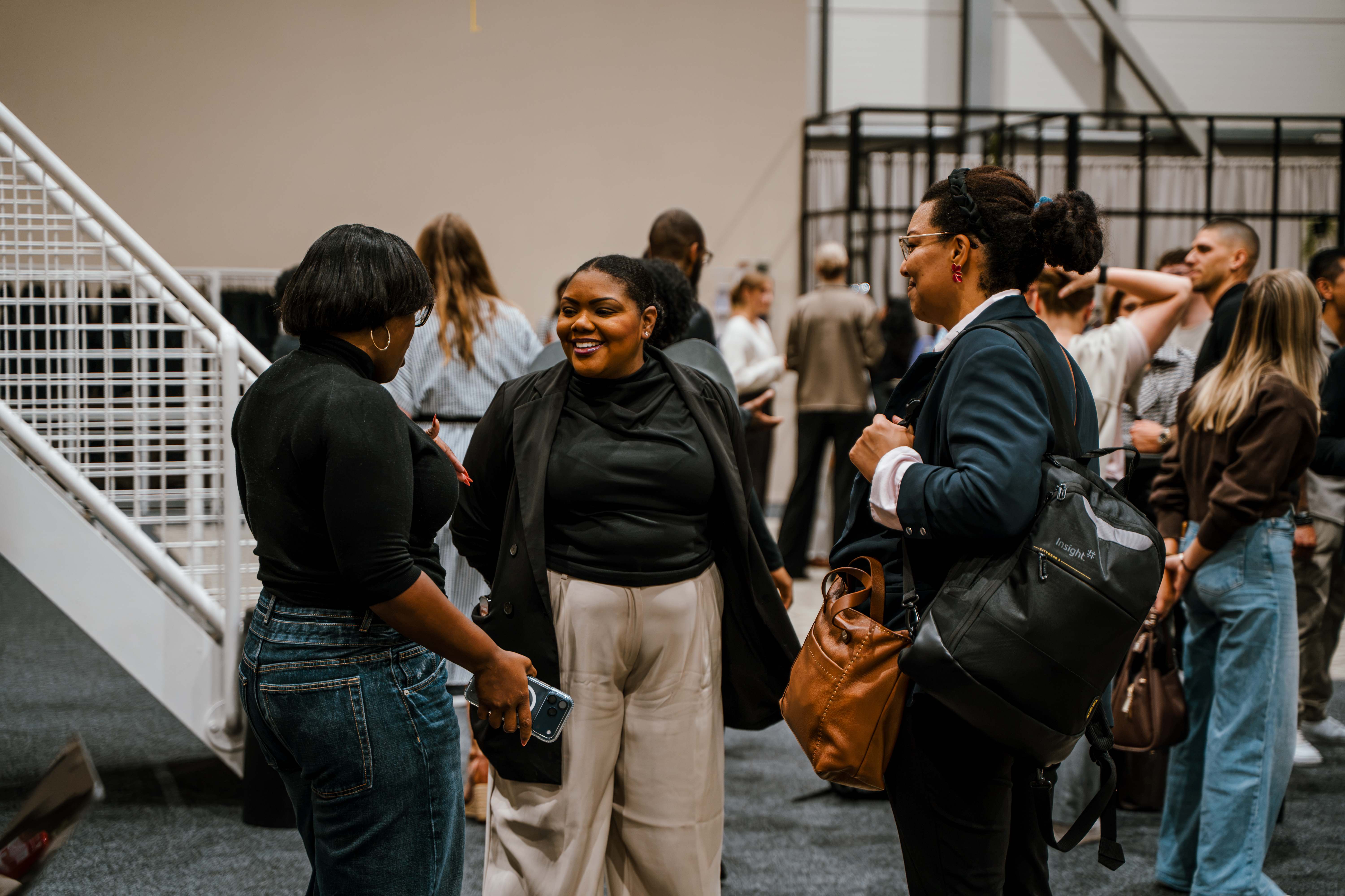 Guests connecting at a River Schools Open House