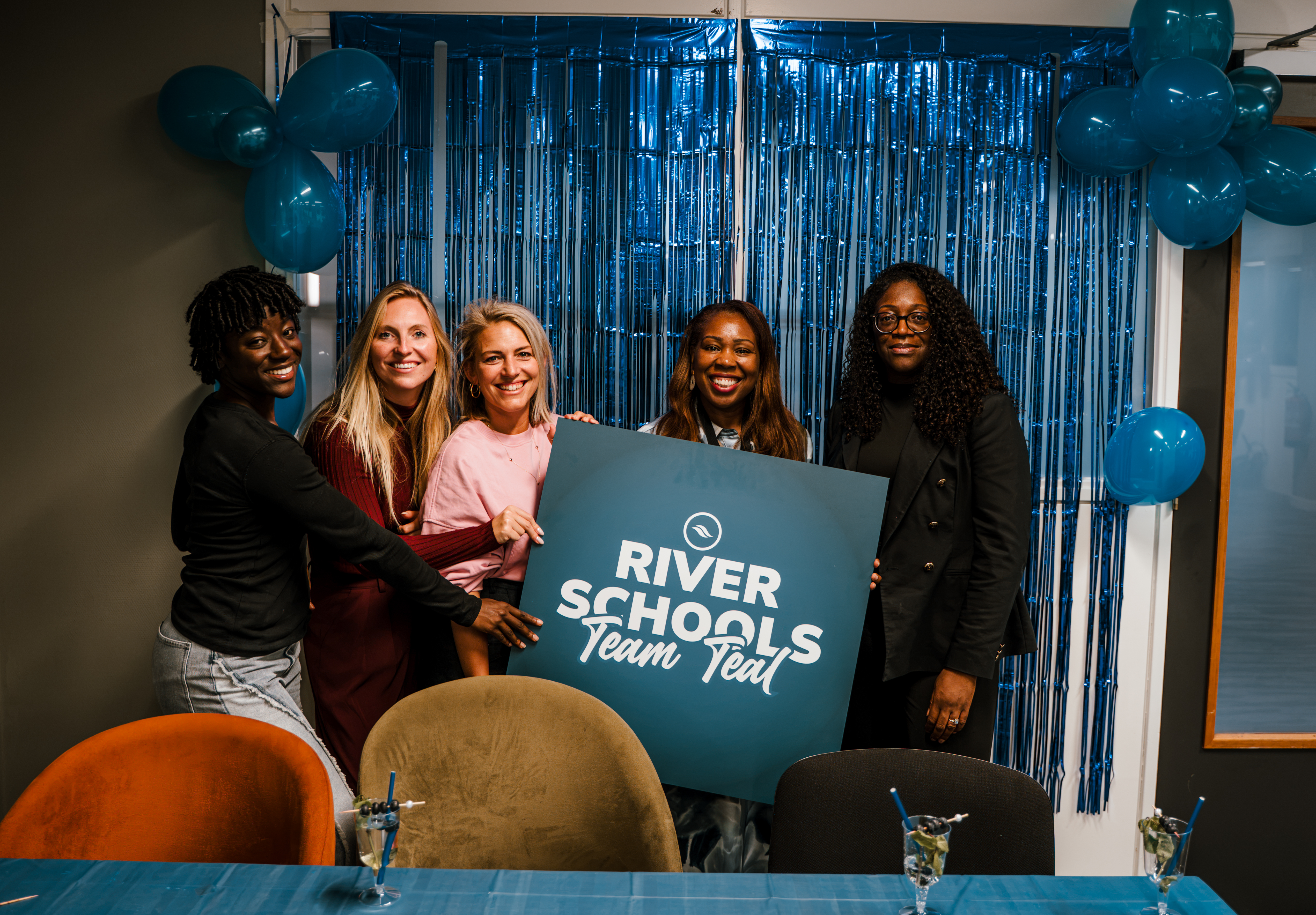 River Schools students and team celebrating together