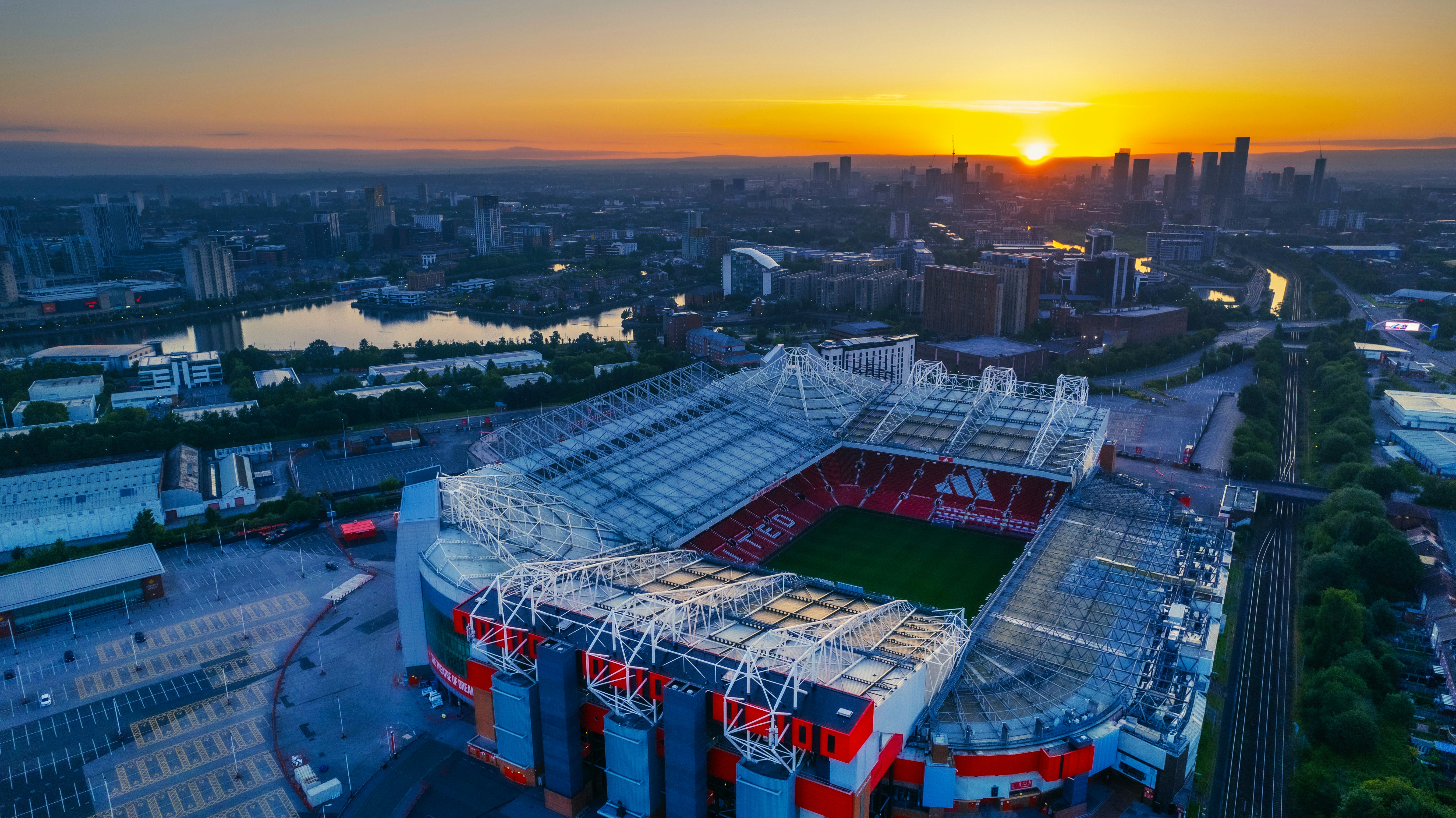 Old Trafford stadium, home of Manchester United, at sunset