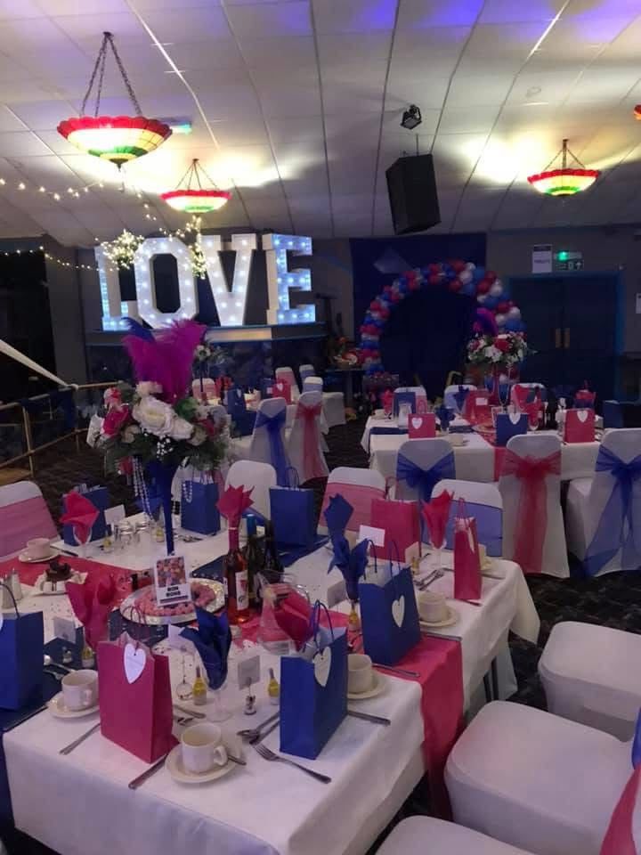 Wedding table settings with LOVE sign at The Stowe