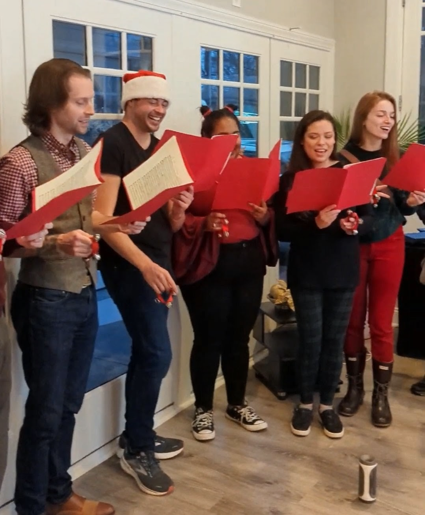 Holiday carolers singing