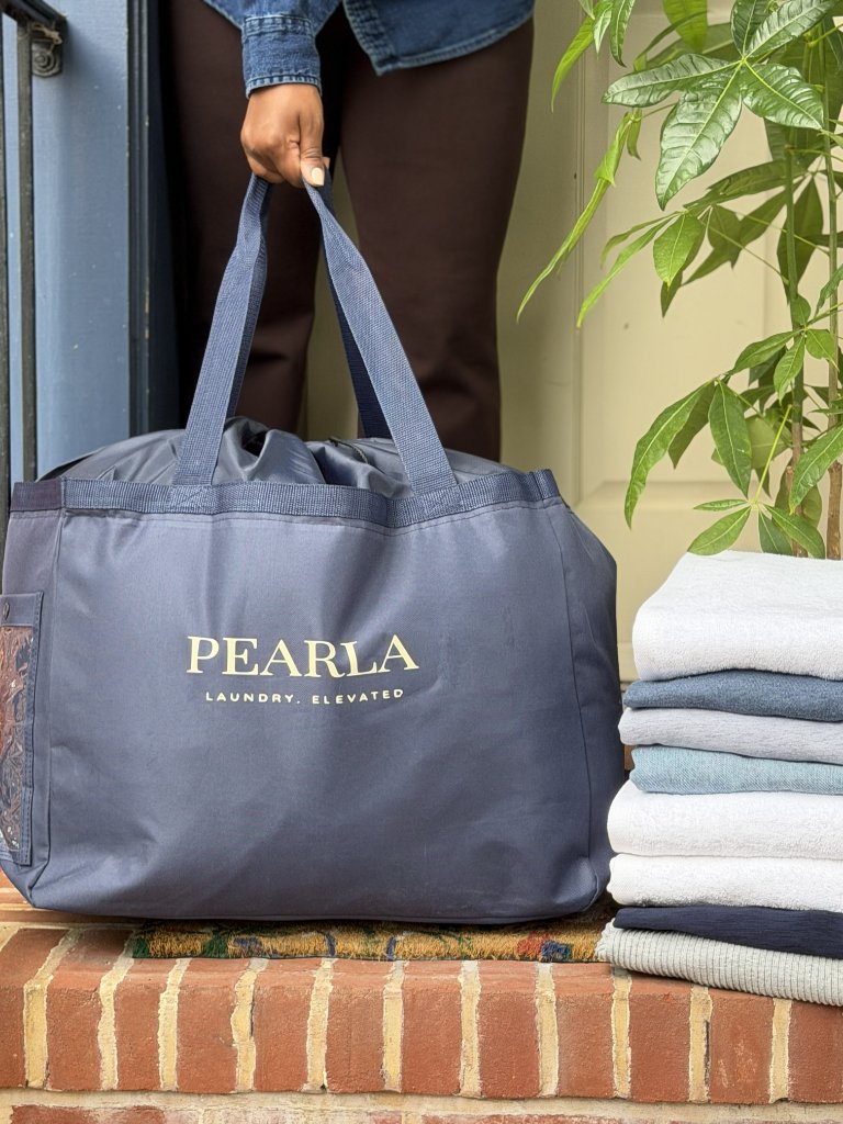Pearla bag being carried for pickup at a Baltimore home
