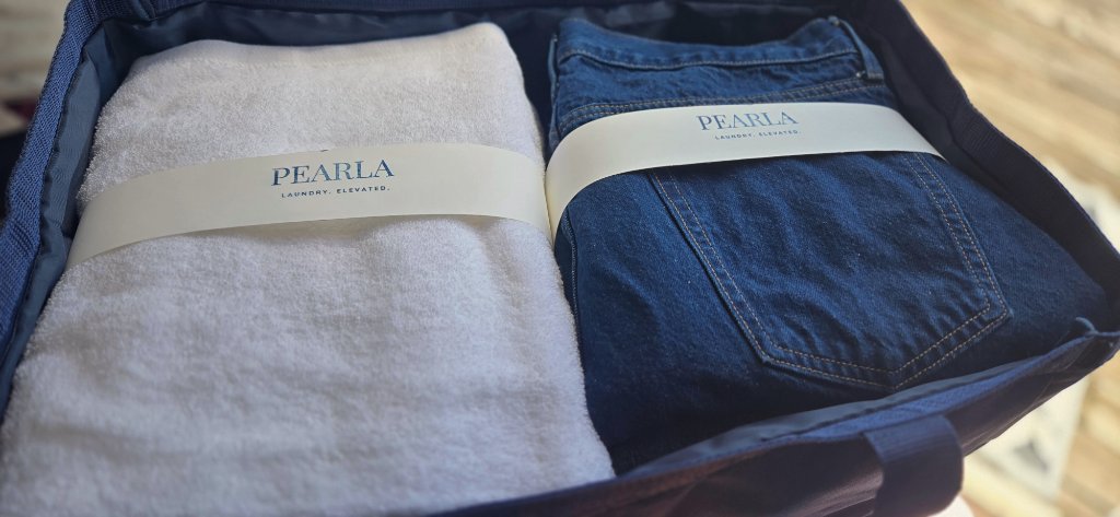 Filling a Pearla bag with a week of laundry