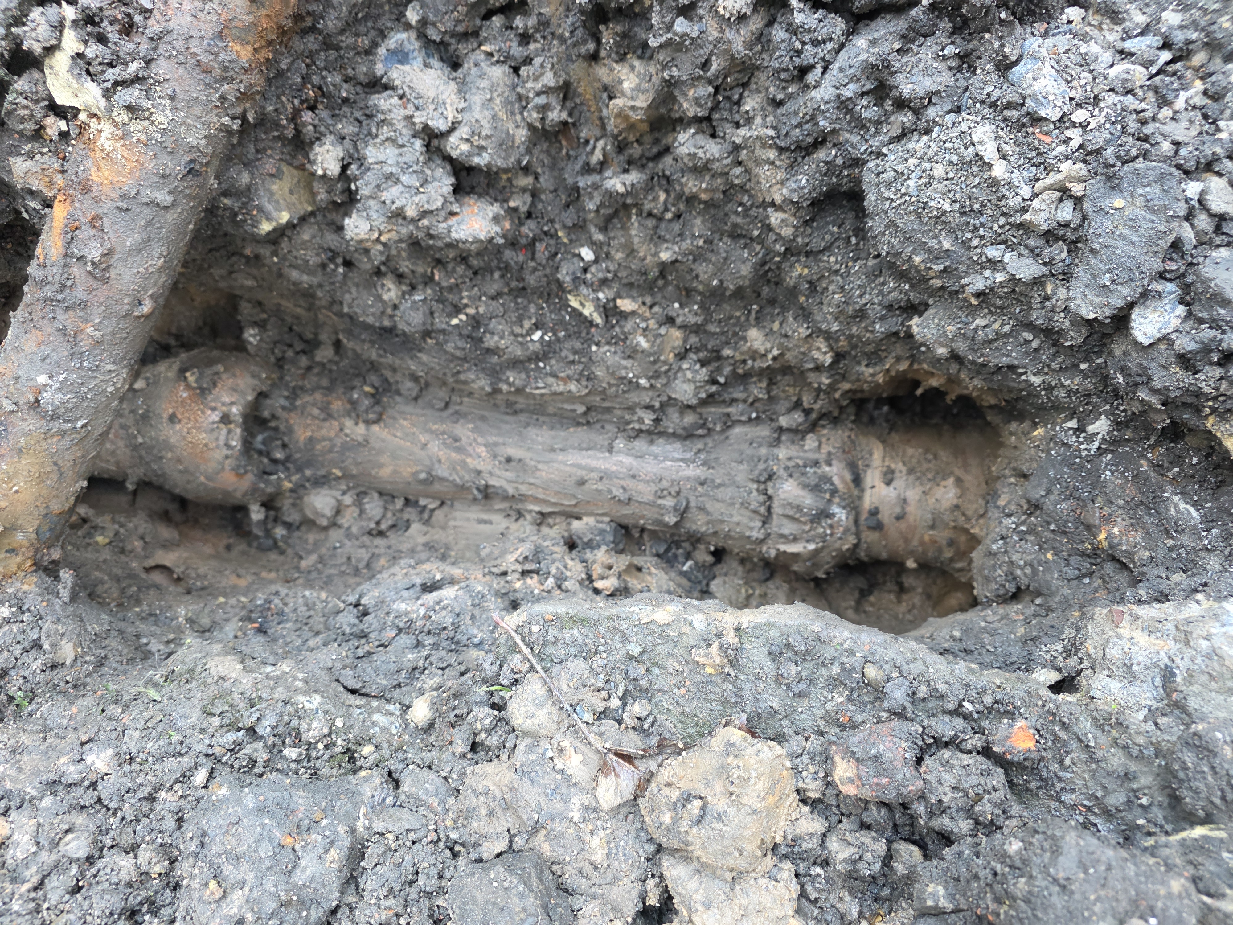 Damaged Pipe in Trench — Before
