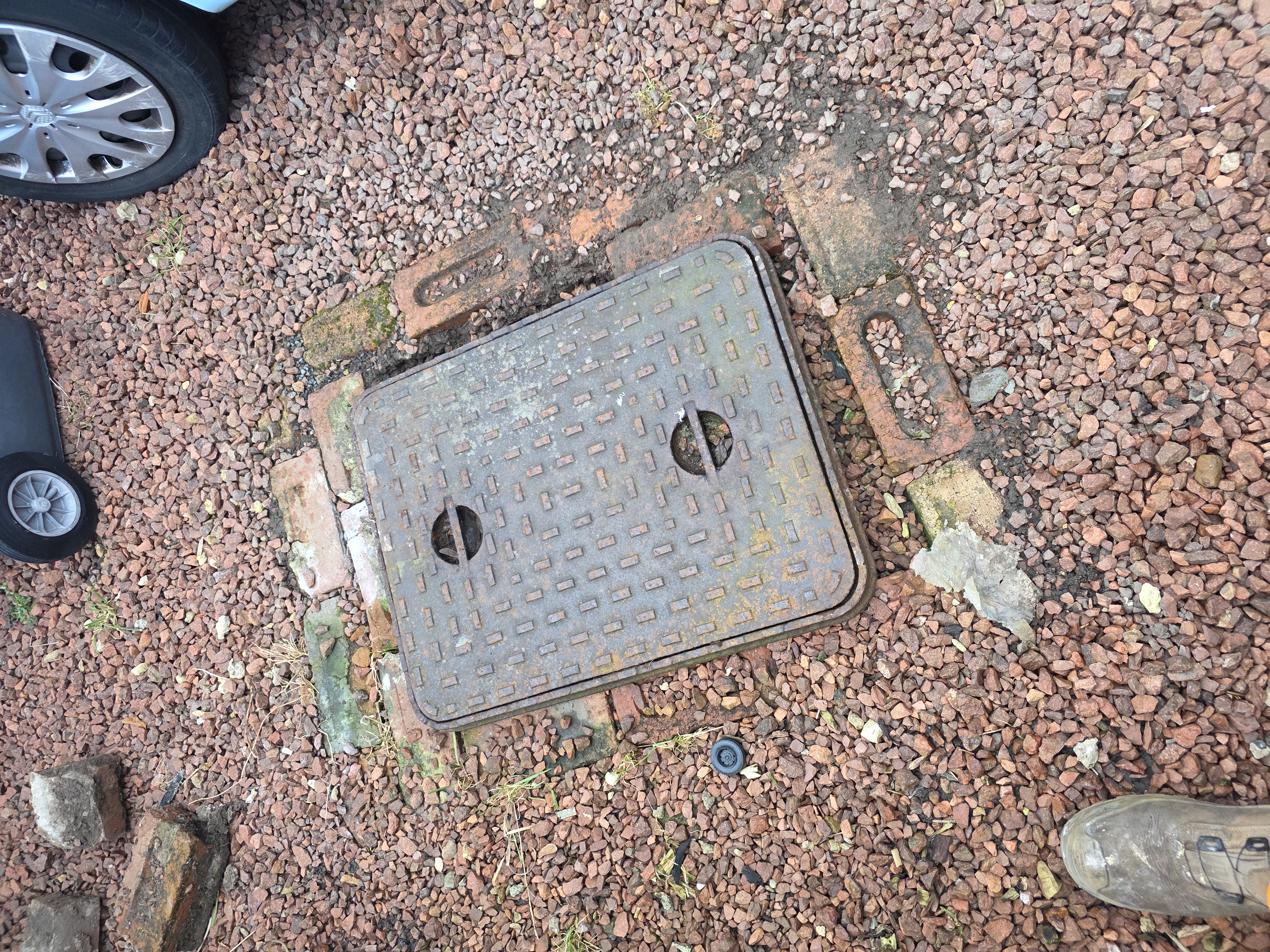 Old Manhole Lid and Frame — Before