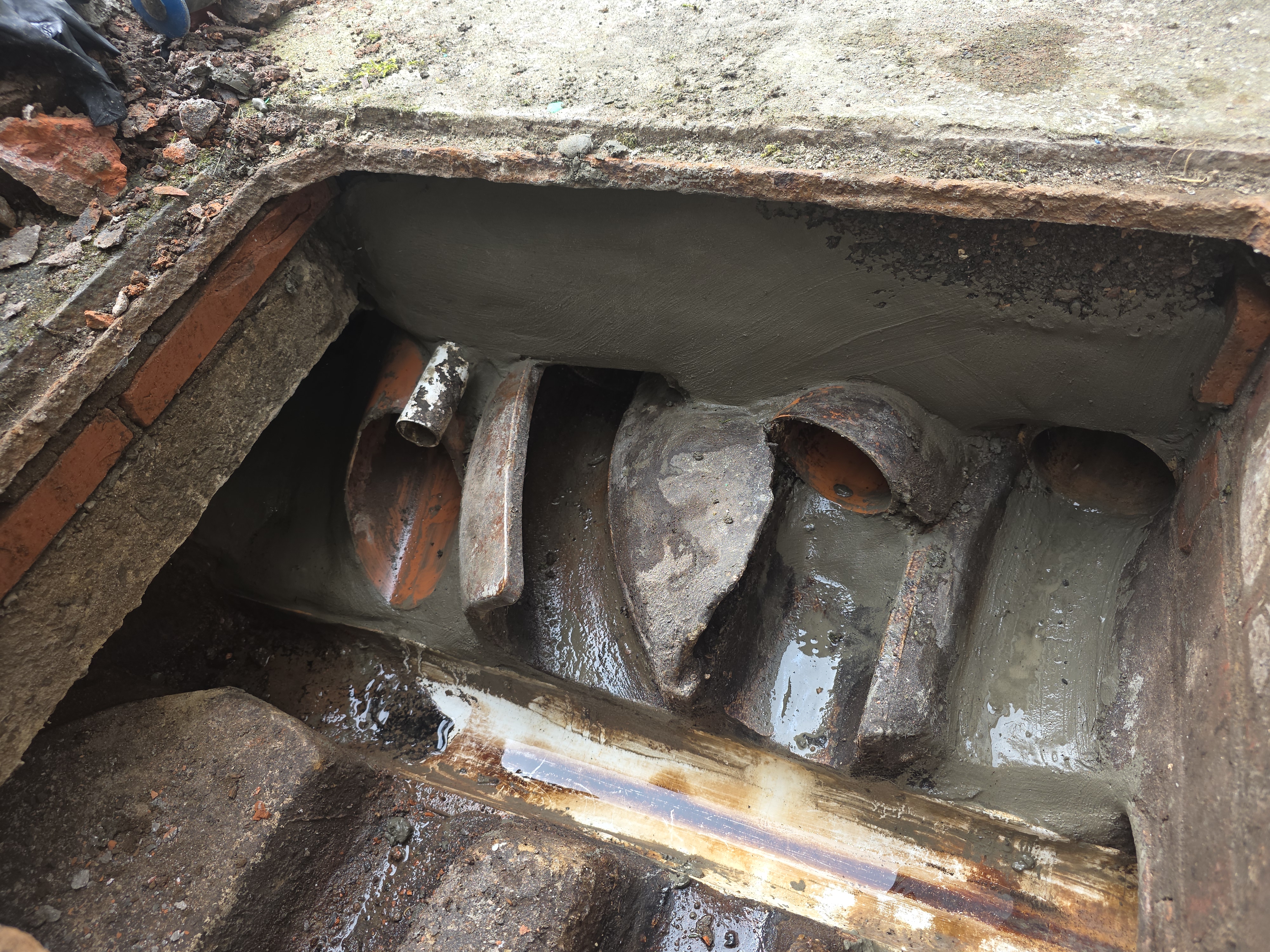 Manhole Repaired and Re-rendered — After