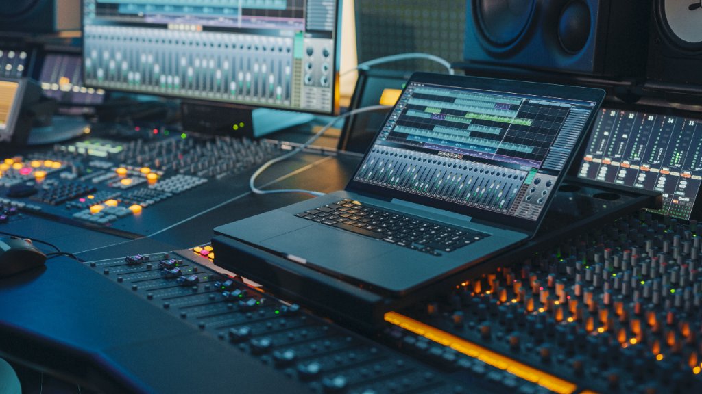 Professional audio production studio with mixing desk