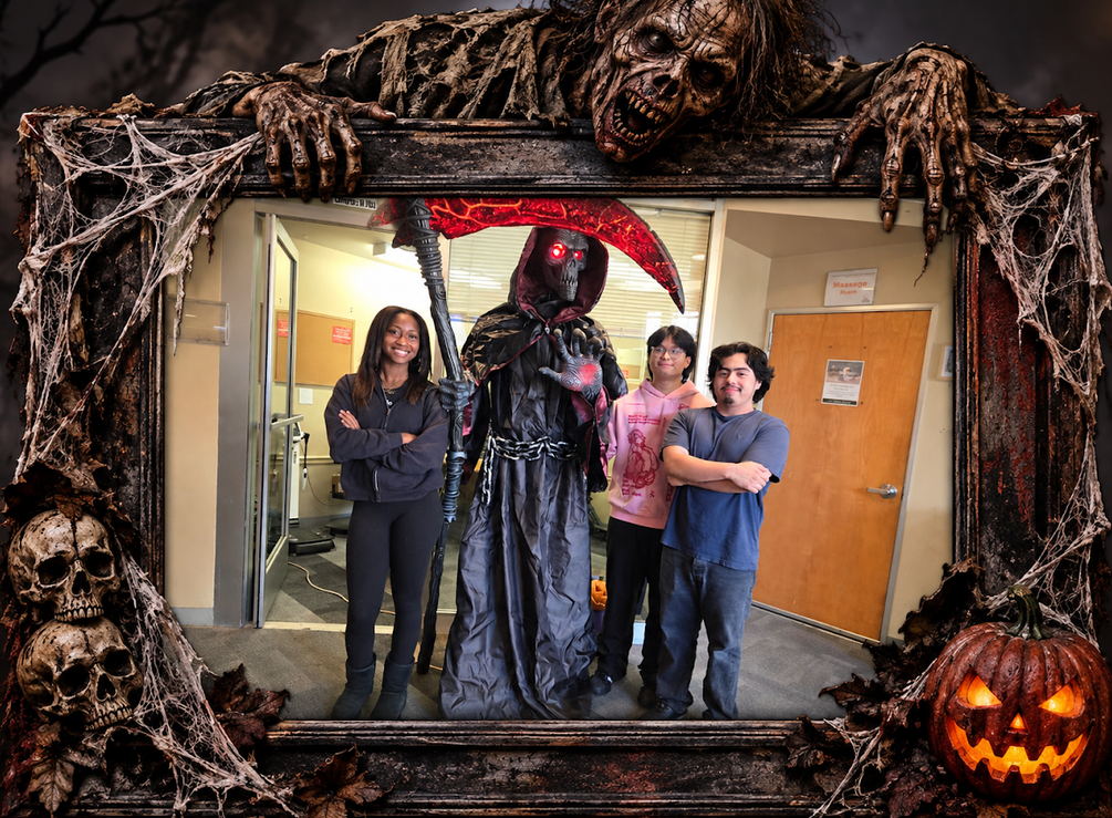 Alameda Fitness & Spa staff with Halloween Grim Reaper display