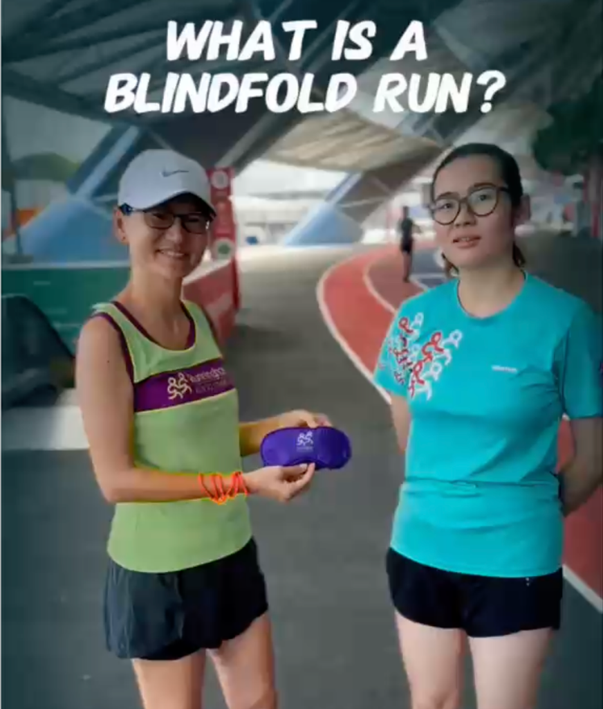 What is a Blindfold Run? Two runners on a track.