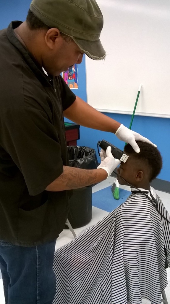 A barber lending a hand at the pep rally