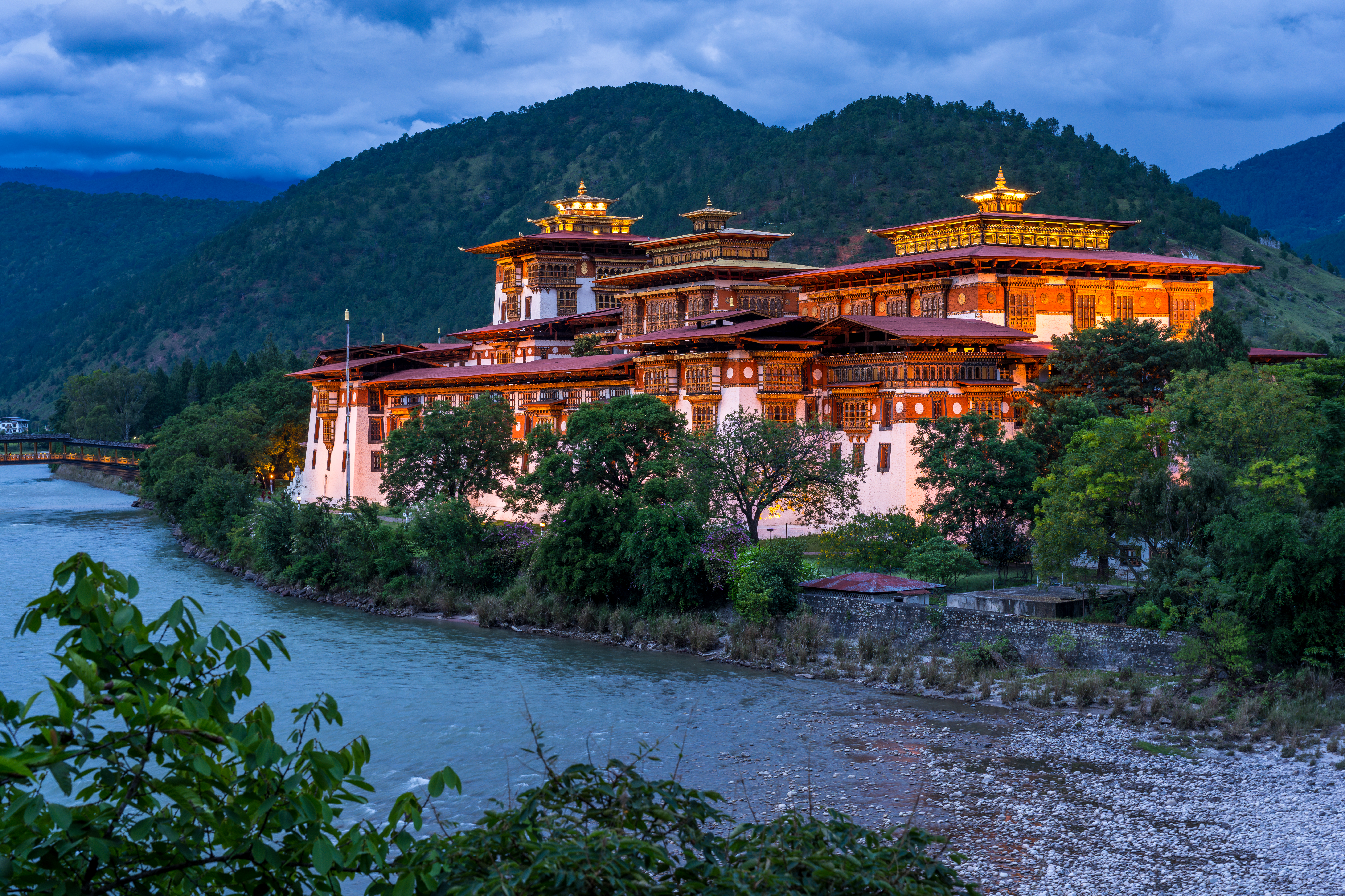 Punakha Dzong lit at twilight above the river