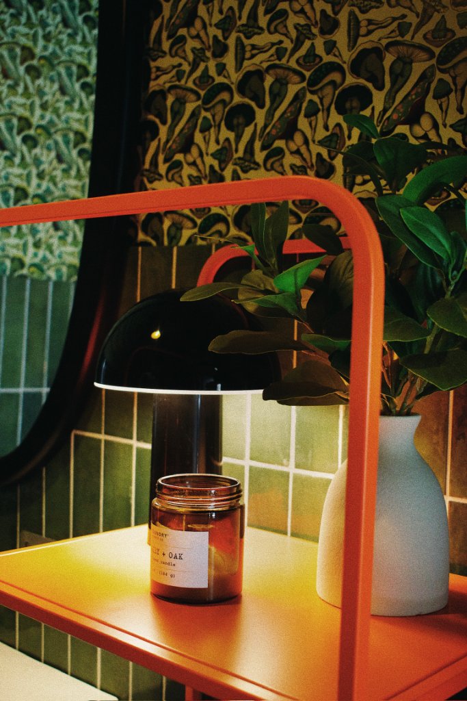 Table lamp with candle and plants