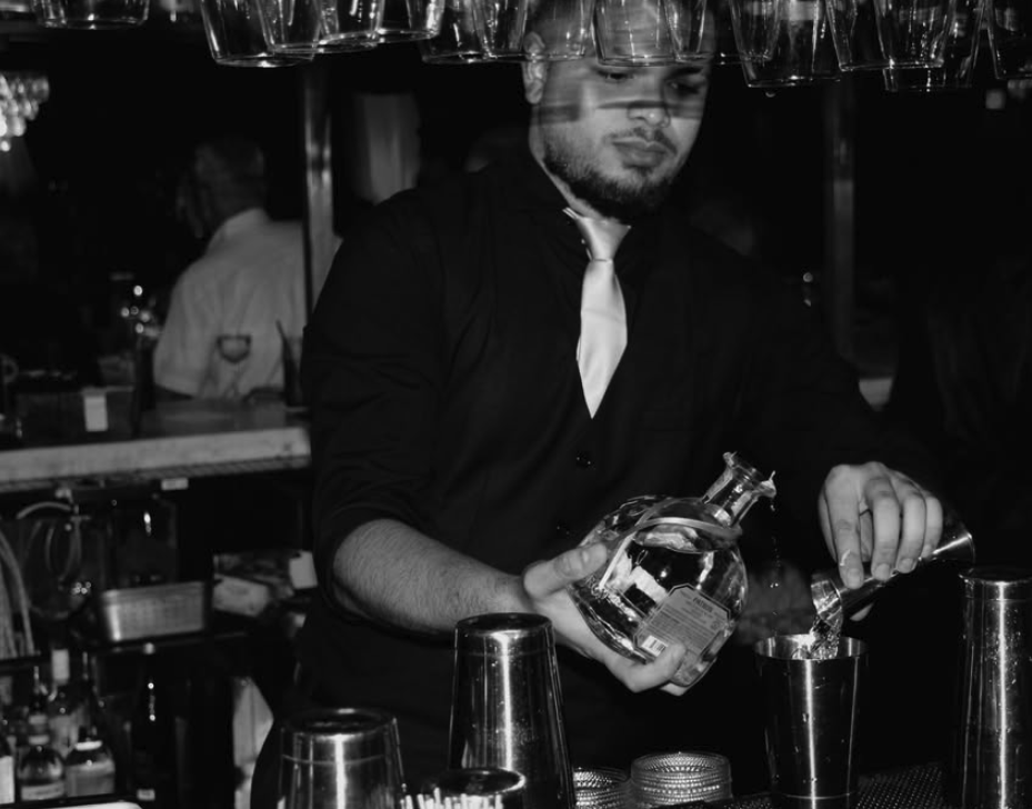 Bartender crafting a cocktail at Jay's
