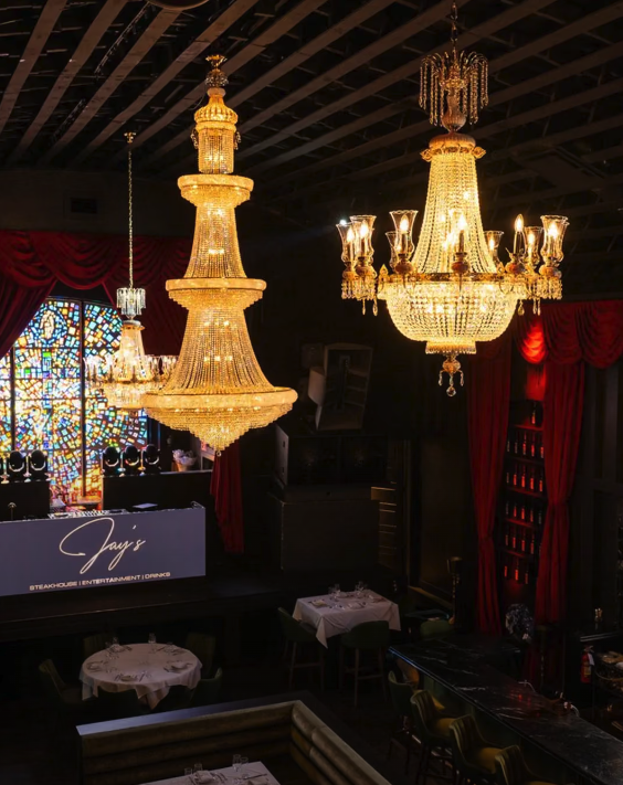 Jay's Fort Lauderdale interior with chandeliers and stage