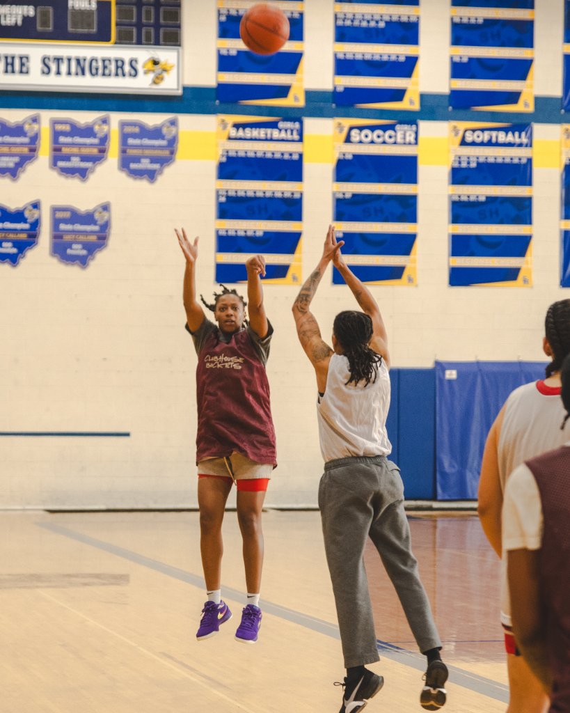 Women playing basketball