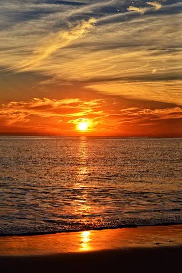Sunset over the Pacific — the golden hour reflected on the water, California coast