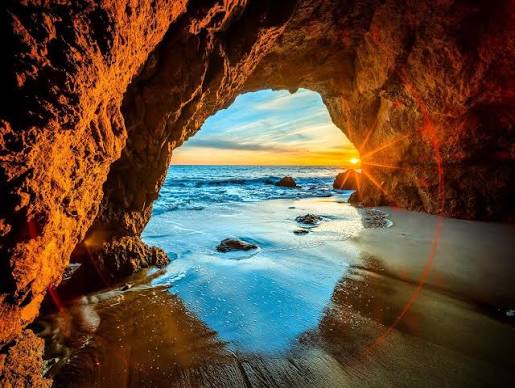 El Matador sea arches — rocky cave opening to the Pacific at golden hour
