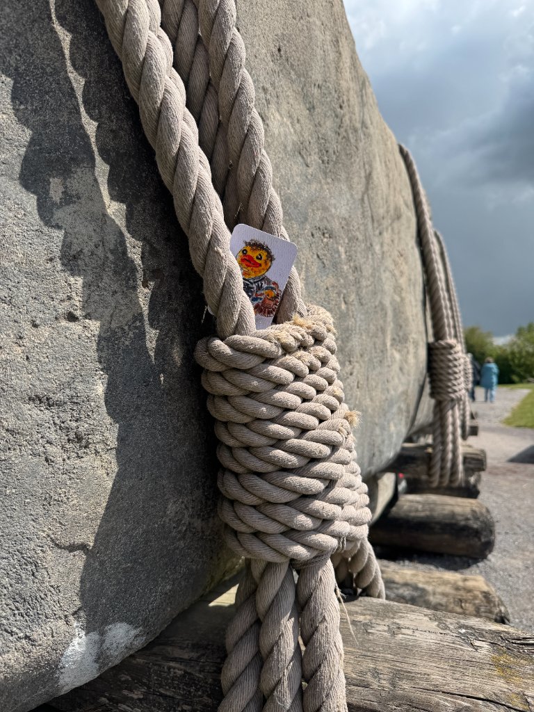 Duck card tucked into the rope around a Stonehenge stone