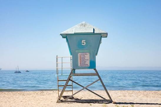 Beach lifeguard tower number 5 on a sandy California beach