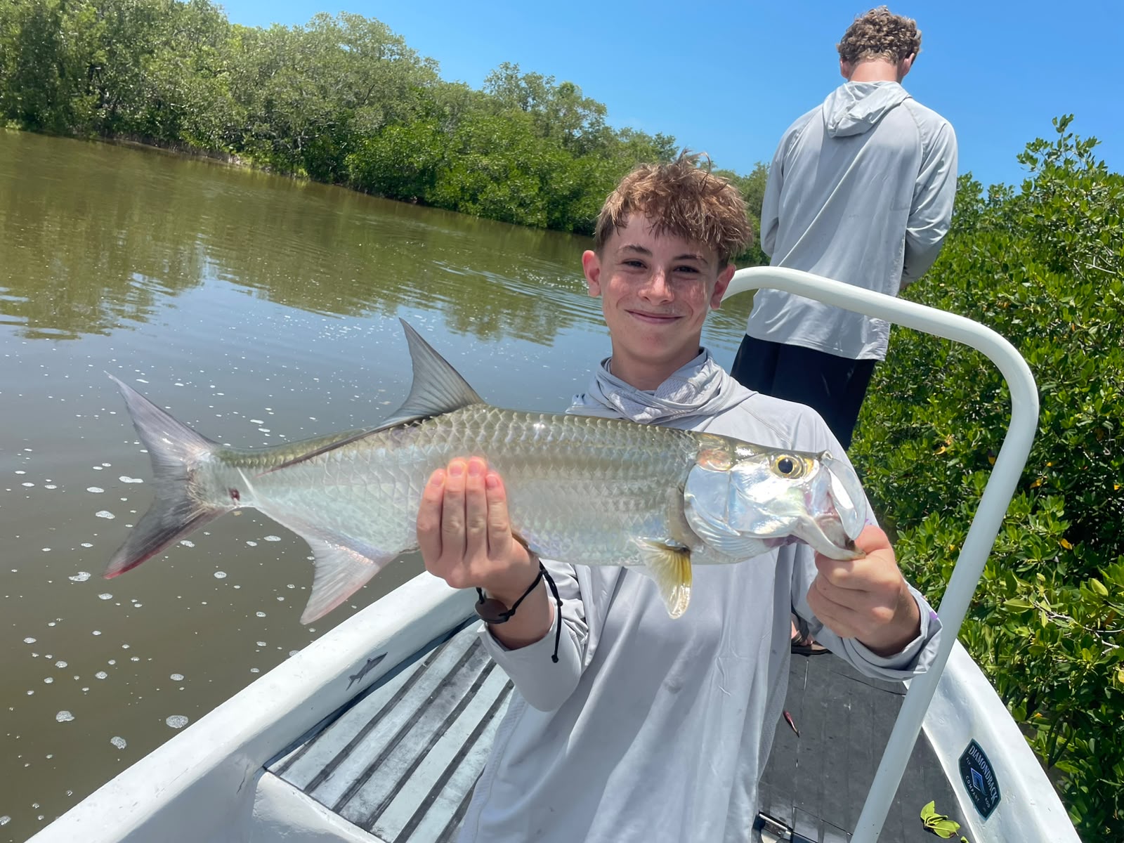 Tarpon fly fishing Holbox Mexico guide with baby tarpon in Caribbean mangroves