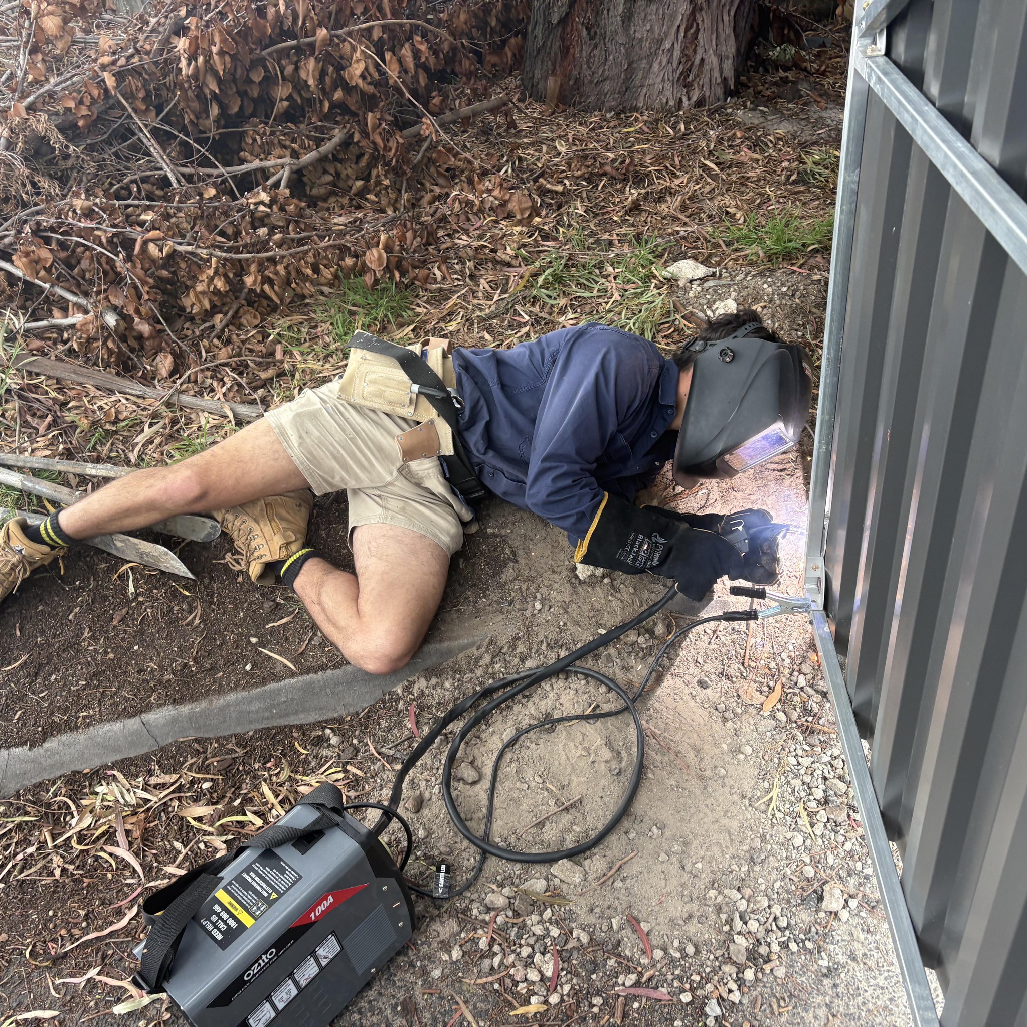 Staff member welding on site