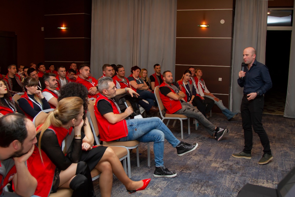 Radu speaking at conference