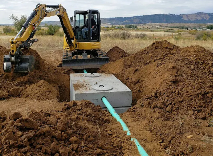 Excavator working on septic installation