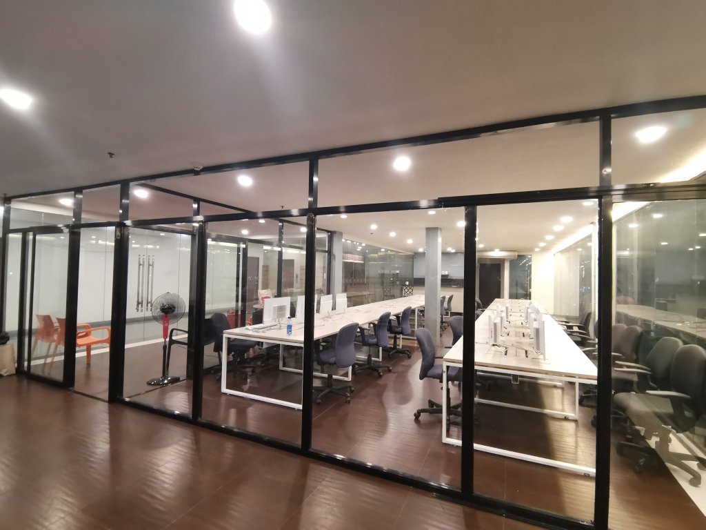 Office interior through glass partition