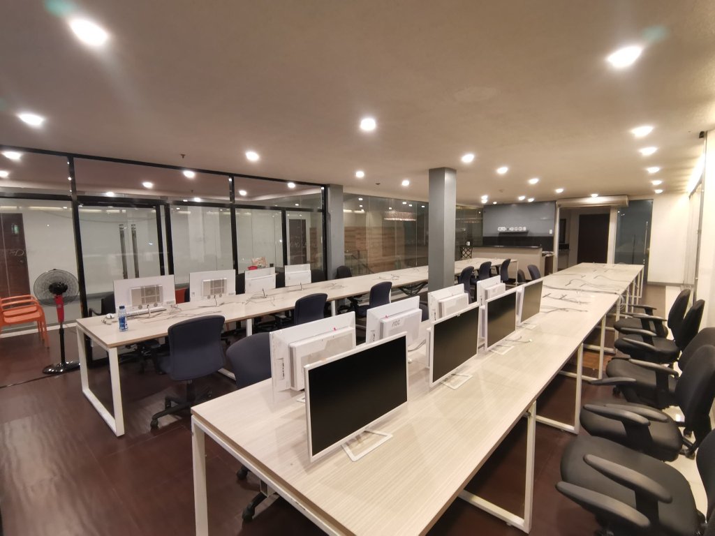 Parallel rows of office workstations