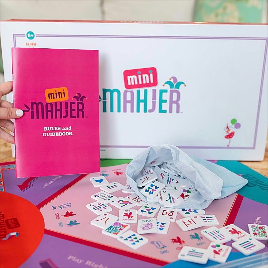 Mini Mahjer game set with box, rules guidebook, and colorful tiles