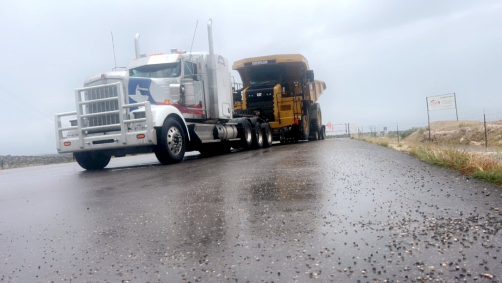 Kenworth Hauling CAT Dump Truck