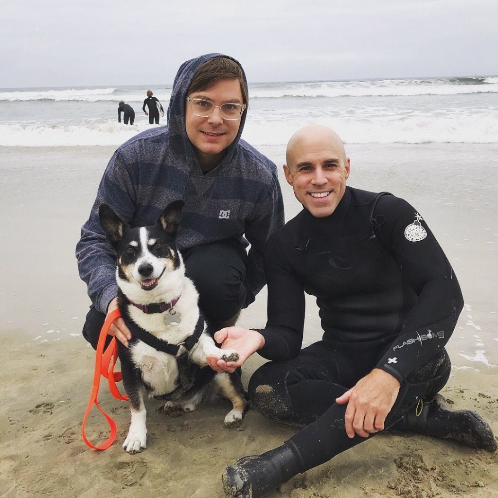 Ed, Nat and their dog at the beach