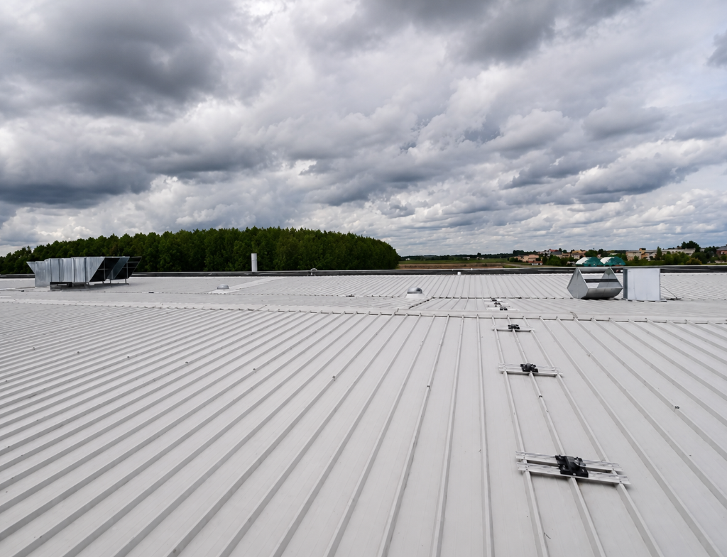 Industrial standing-seam metal roof on a commercial building in Denver
