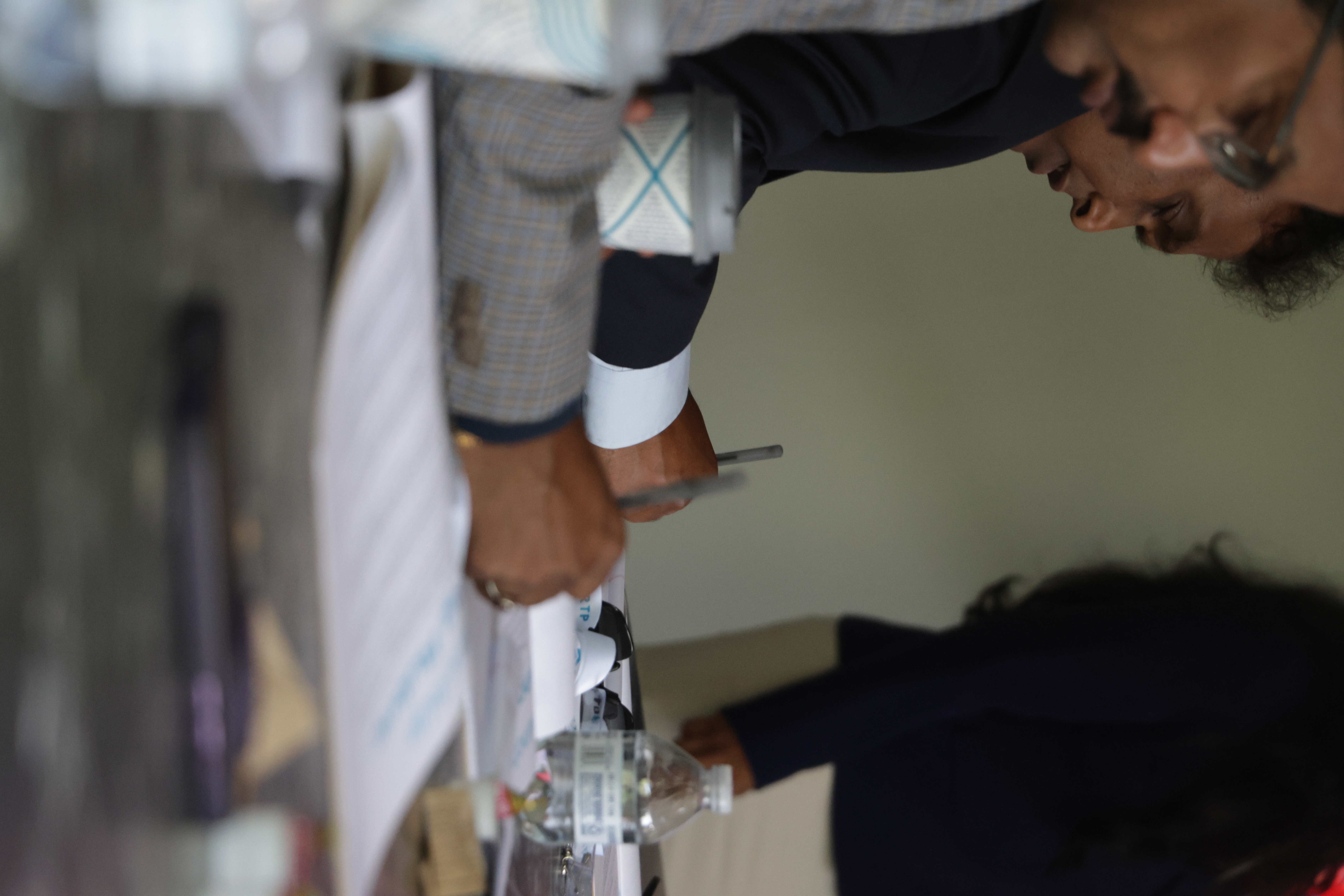 Participants reviewing documents at a conference table during Launch Up