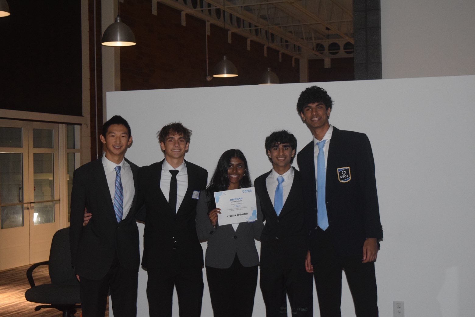 First place winners holding their certificate at Startup Spotlight
