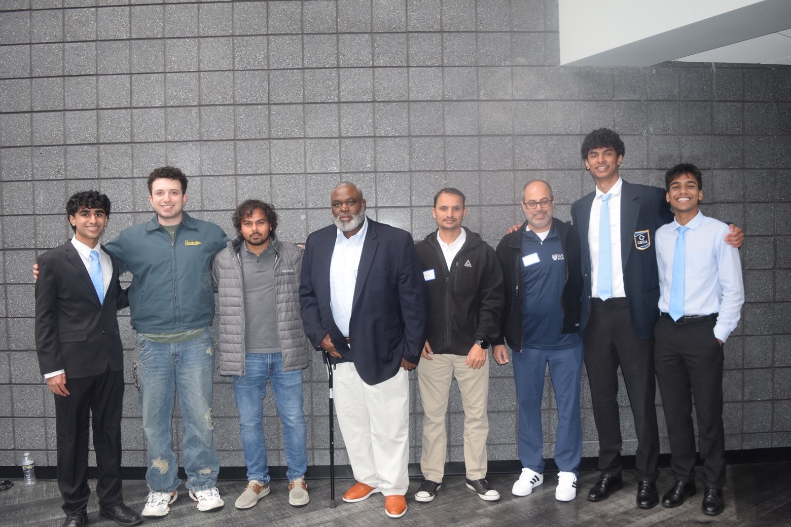 Eight participants posing together at Startup Spotlight