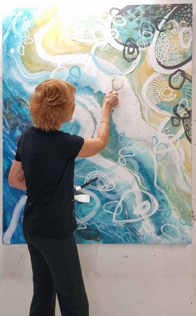 Dallas Lesley painting in her studio