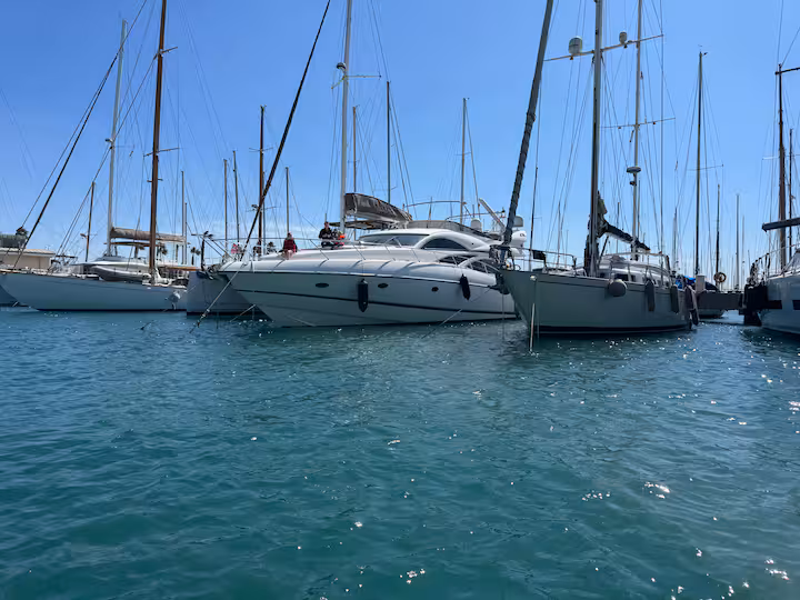 Amato berthed in marina — stern view