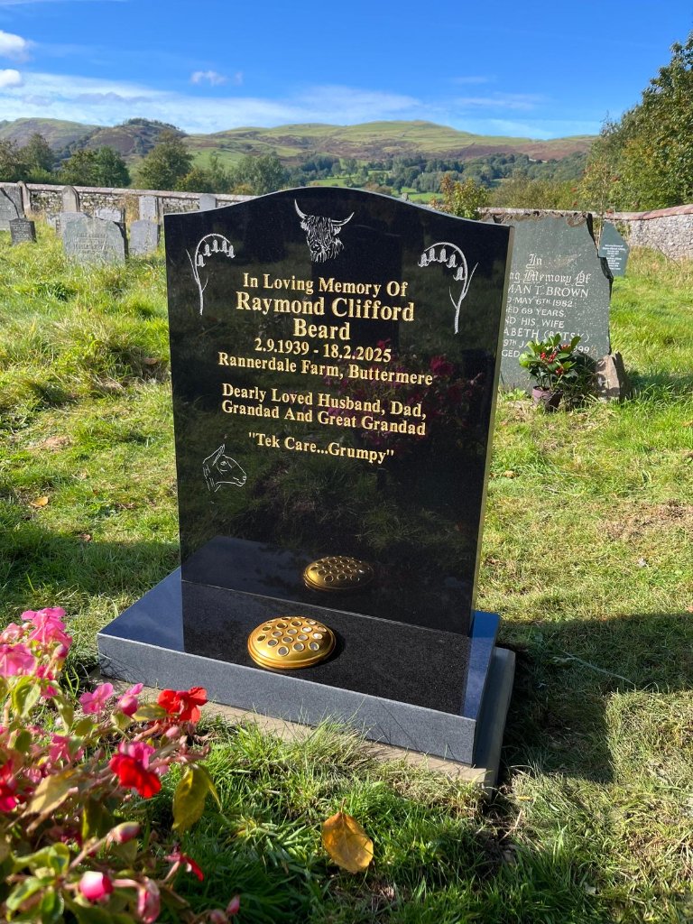 Black granite headstone with Highland cow engraving