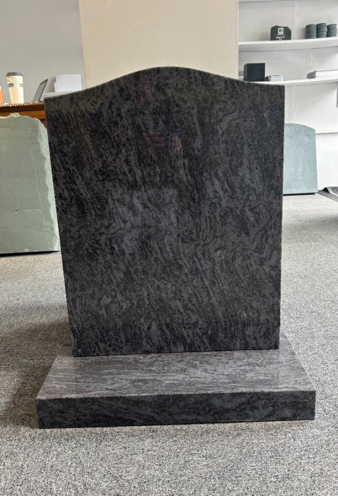 Black granite headstone in showroom