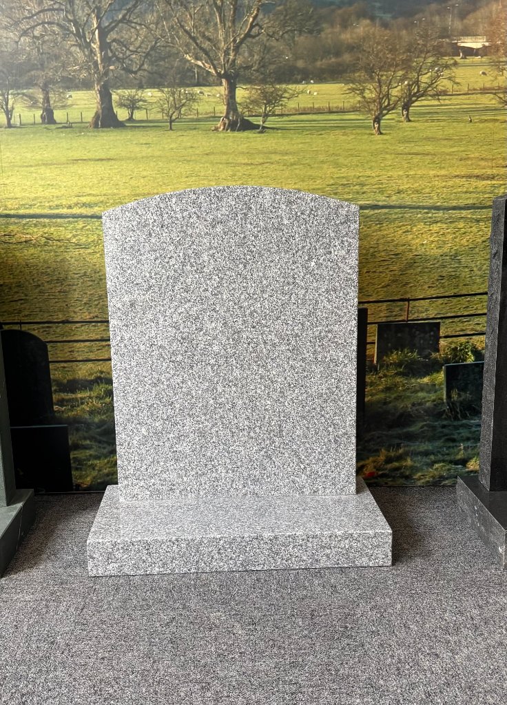 Grey granite memorial in showroom