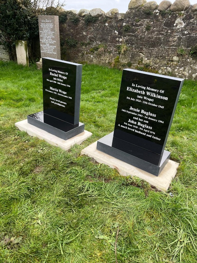 Twin black granite headstones