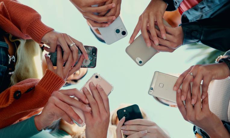 People texting on phones