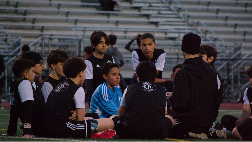 Crescent Academy players developing ball control during an active soccer training drill in North Jersey